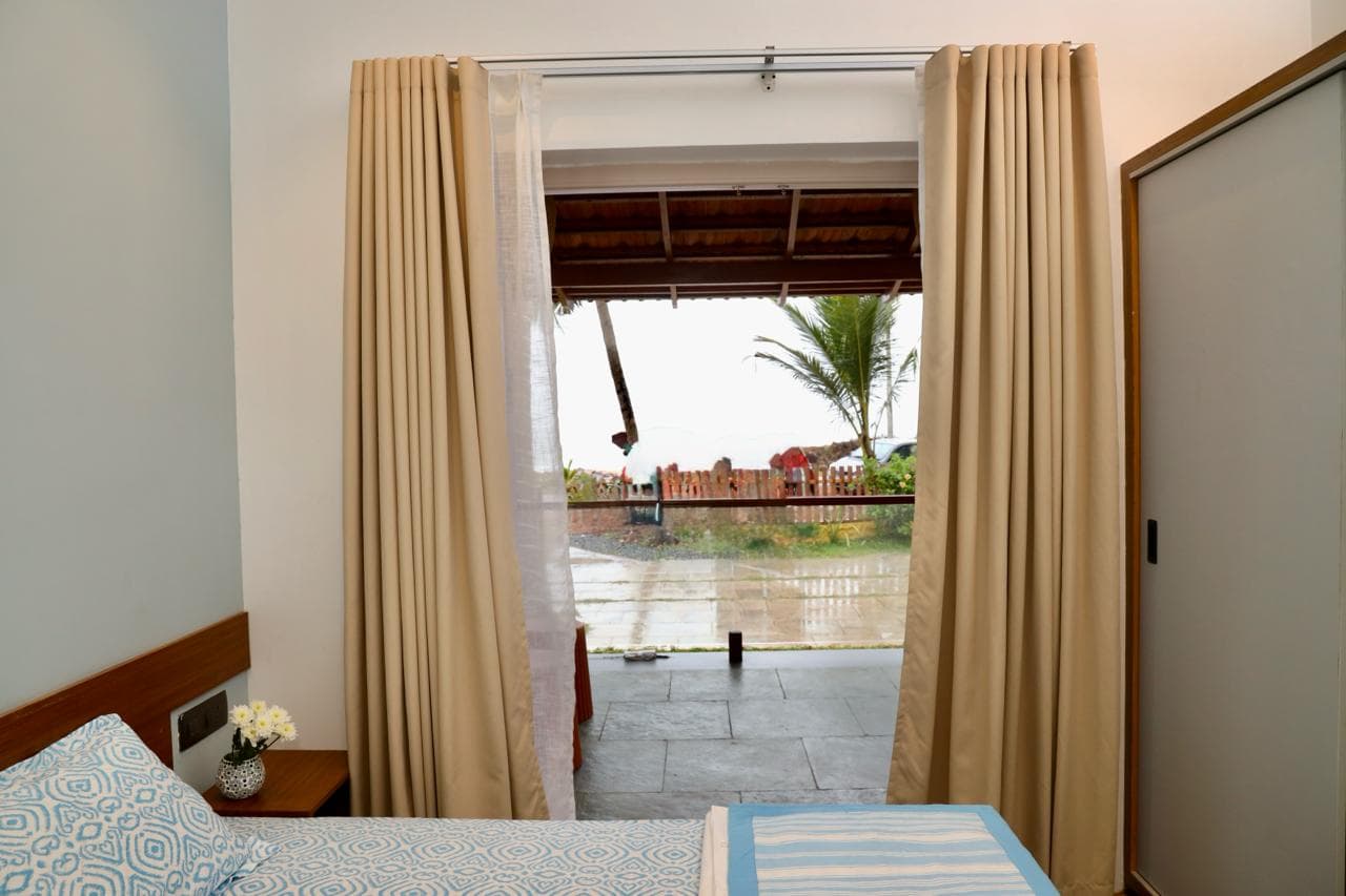 Bedroom opening toward the sea-facing porch