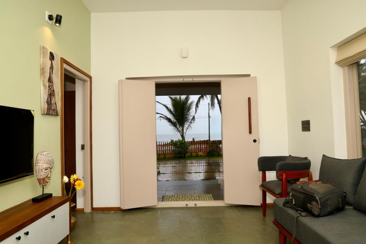 Living space with doors opening to the sea-facing side
